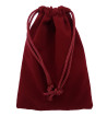 Burgundy colored drawstring velveteen bag shown closed holding a stone rune set.