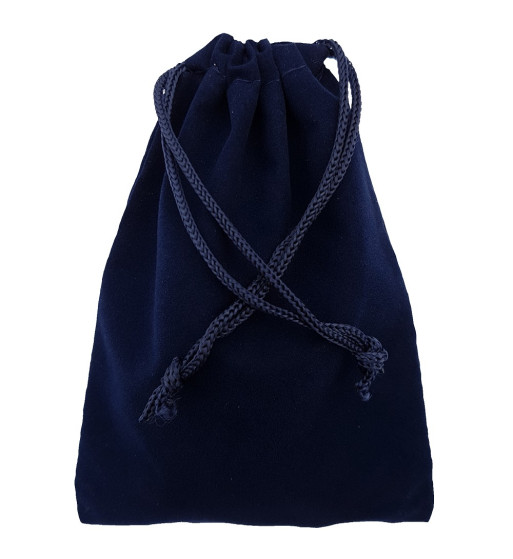 Navy blue colored drawstring velveteen bag shown closed holding a stone rune set.