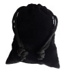 Small black colored drawstring velveteen bag shown closed holding a stone rune set.