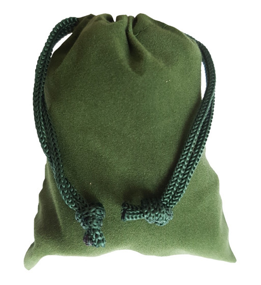 Small green colored drawstring velveteen bag shown closed holding a stone rune set.