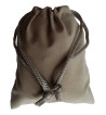 Small grey colored drawstring velveteen bag shown closed holding a stone rune set.