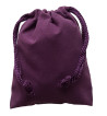 Small purple colored drawstring velveteen bag shown closed holding a stone rune set.