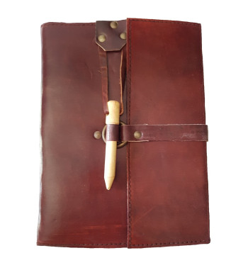 Brown leather medieval journal has a fold over cover with loop and wooden peg closure.