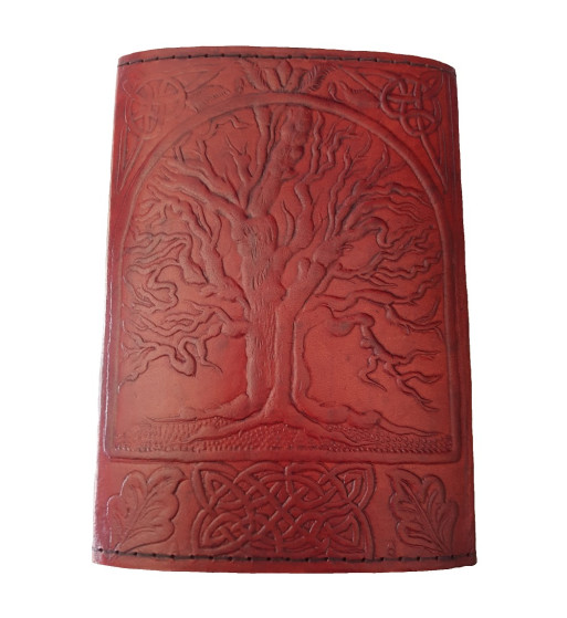 The front cover of the Sacred Oak Tree Leather Journal has an embossed tree and Celtic knotwork design.