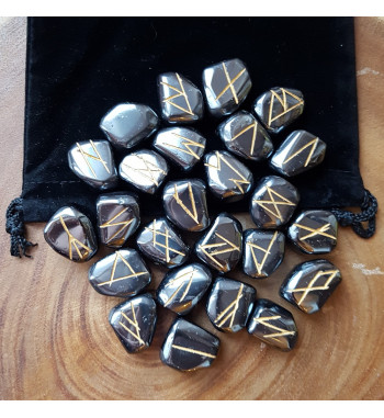 Tumbled Hematite stone runes feature gold colored Elder Futhark and come with a black velveteen rune pouch.