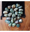 Moss Agate rune stones engraved with the Elder Futhark colored gold.  Each set comes with a black rune pouch.