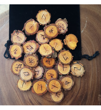 Willow rune set featuring the Elder Futhark burned onto slices of a Willow branch. Rune set comes with a black velveteen pouch.