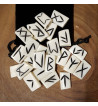 Bone runes made of buffalo bone featuring black Elder Futhark runes. Set includes a black velveteen pouch.