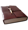 Brown leather medieval journal has a fold over cover with loop and wooden peg closure.