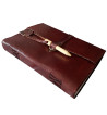 Brown leather medieval journal has a fold over cover with loop and wooden peg closure.