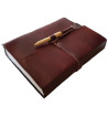 Brown leather medieval journal has a fold over cover with loop and wooden peg closure.