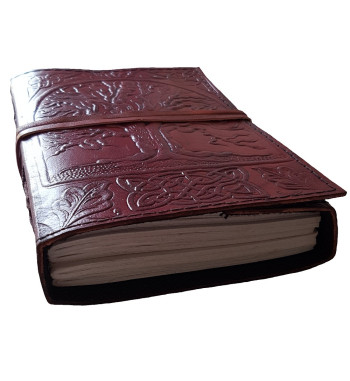 The front cover of the Sacred Oak Tree Leather Journal has an embossed tree and Celtic knotwork design.