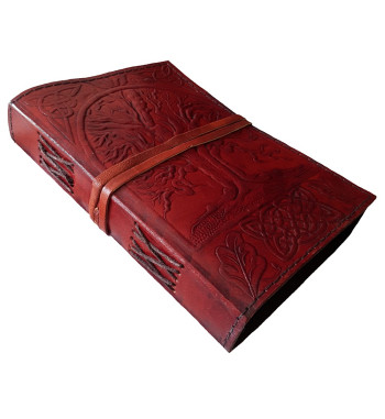 The front cover of the Sacred Oak Tree Leather Journal has an embossed tree and Celtic knotwork design.