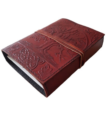 The front cover of the Sacred Oak Tree Leather Journal has an embossed tree and Celtic knotwork design.