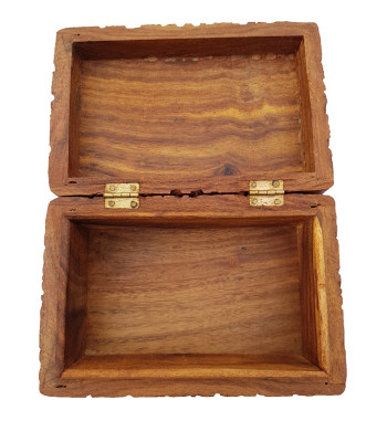The Floral Triquetra Box is a wooden box with a carved floral pattern surrounding a triquetra.