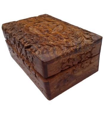 The Floral Triquetra Box is a wooden box with a carved floral pattern surrounding a triquetra.