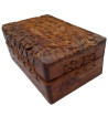 The Floral Triquetra Box is a wooden box with a carved floral pattern surrounding a triquetra.