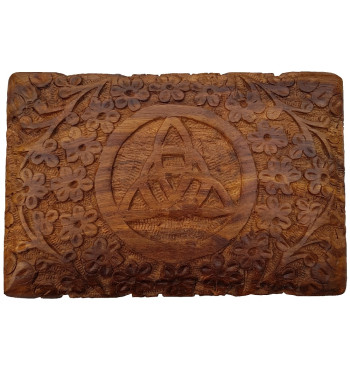 The Floral Triquetra Box is a wooden box with a carved floral pattern surrounding a triquetra.